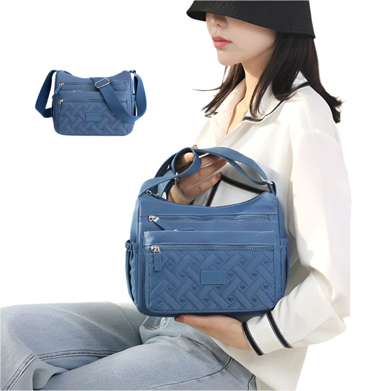 Clara - Lett skulderveske med justerbar stropp og glidelåslommer